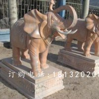 象鼻向上大象石雕，晚霞红大象雕塑